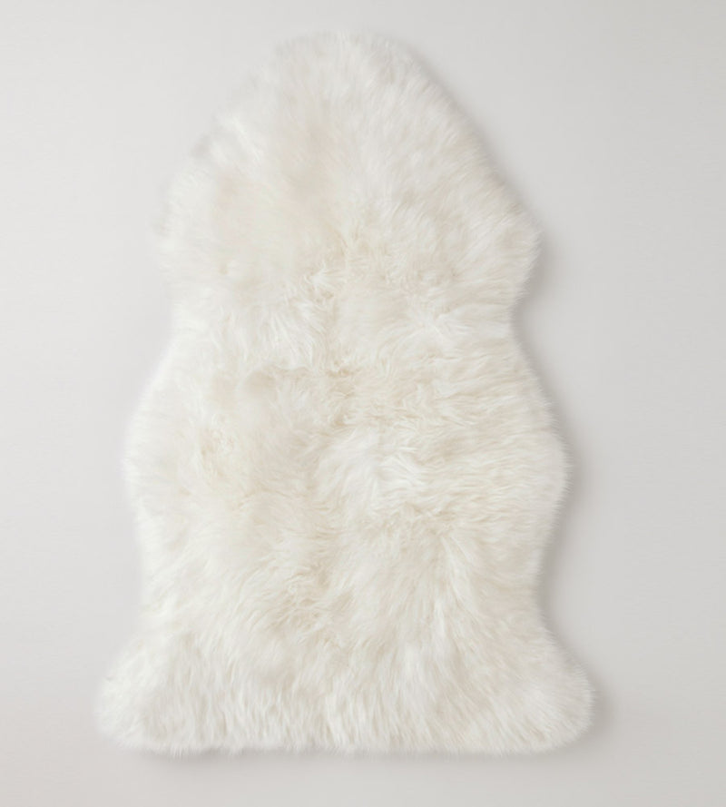 Ivory colored sheepskin pads create a natural motorcycle seat cover, provide luxurious comfort