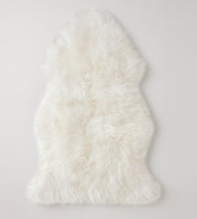 Ivory colored sheepskin pads create a natural motorcycle seat cover, provide luxurious comfort